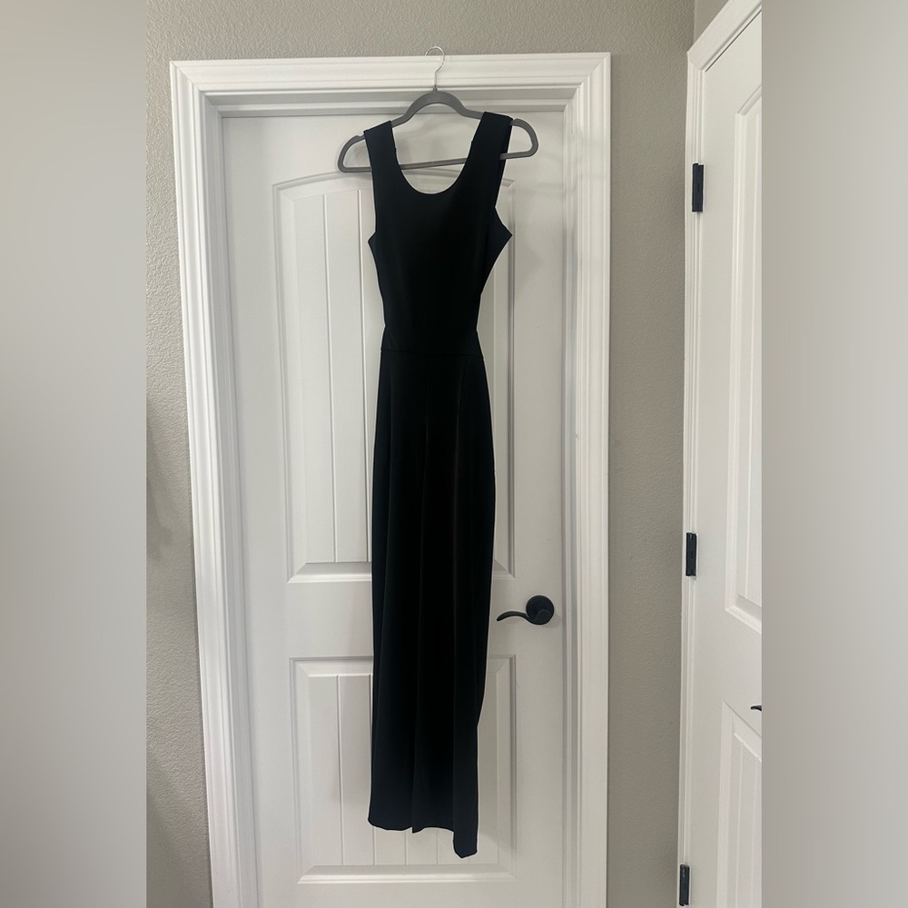 Express Jumpsuit…It has a silver zipper in the back for closure and open back.